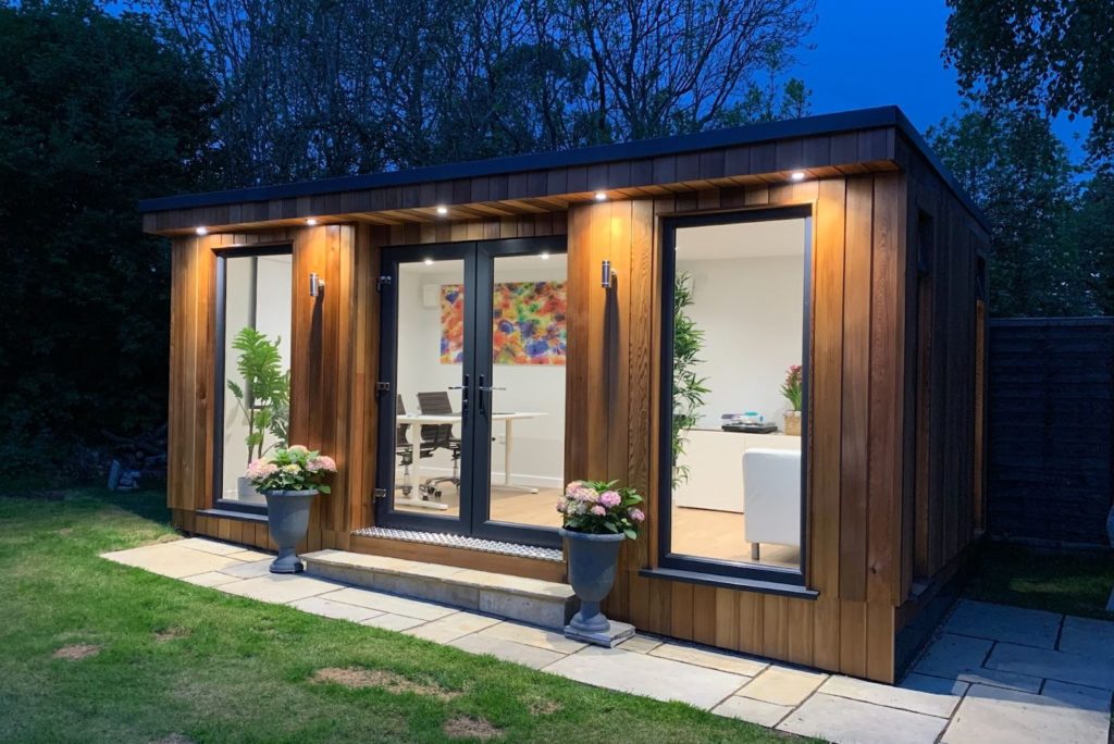 Garden room buildings at night 