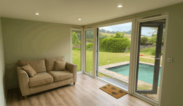garden room with swimming pool